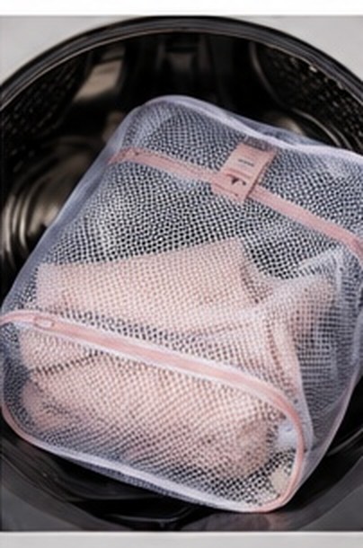 A pink garment in a mesh wash bag inside a washing machine