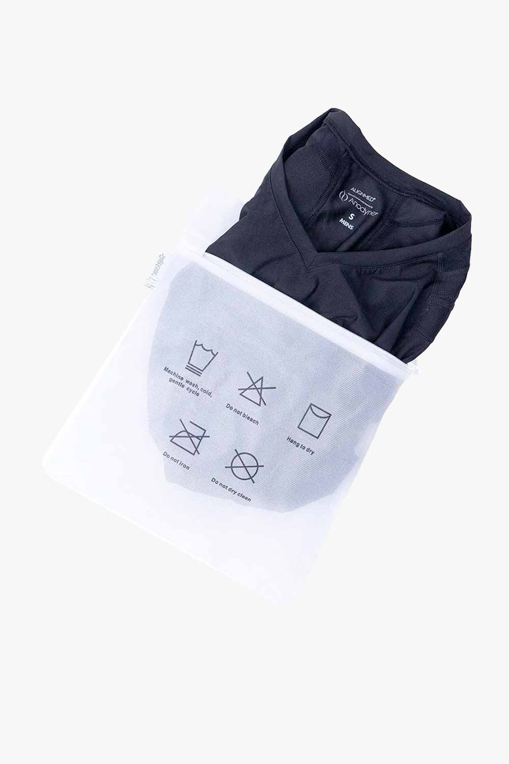 Activewear inside a mesh washing bag with care symbols