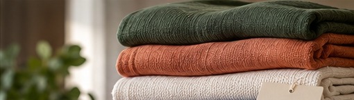 Neatly folded warm-toned garments