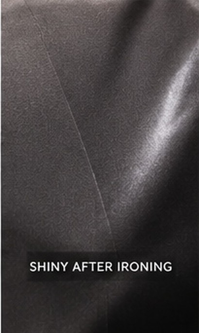 Close-up of a shiny mark on dark fabric after ironing
